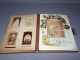 an open book with pictures of people and animals on it