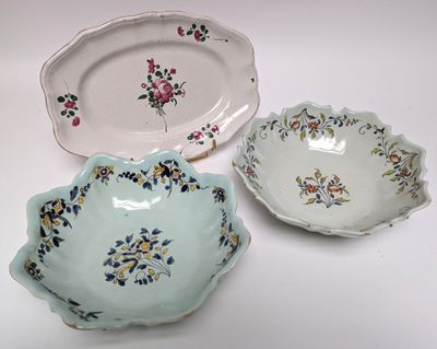 three plates that have flowers on them on them