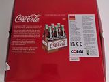 a box of coca cola sitting on a table