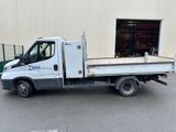 a white truck that is parked in front of a building