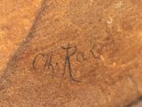 a close up of a piece of wood with writing on it