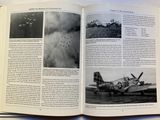 an open book with a picture of a plane on it