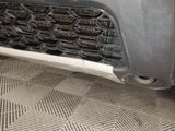 a close up view of a car ' s grille and bumper