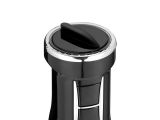 the black and chrome coffee maker is sitting on a white surface