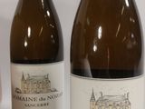 three bottles of wine sitting next to each other on a table