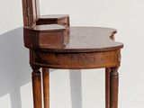a chair that is sitting on a table in front of a white wall