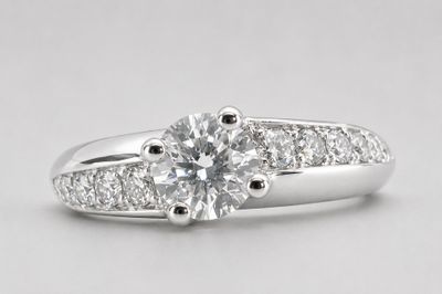 a white gold engagement ring set with a round brilliant cut diamond