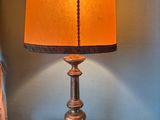 a lamp that is sitting on a table in a room