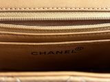 the inside of a chanel bag with the zipper open