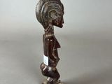 a close up of a figurine of a person on a skateboard