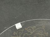 a glass table with a glass top with a design on it
