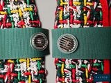 a pair of colorful socks with a green tie and a button
