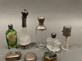 a lot of glass and silver items on the table