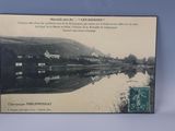 a picture of a postcard with a picture of a river in the background