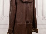 the back of a brown leather coat on a mannequin mannequin mannequin mannequin mannequin mannequin mannequin manne