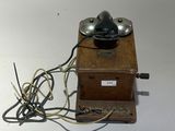 a small wooden box with a lamp on top of it
