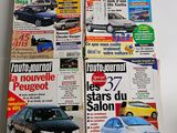 two magazines of different cars on display on a white surface
