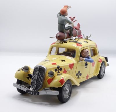 a toy car with a man sitting on top of it