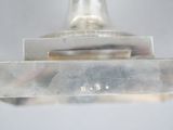 a close up of a silver object on a table