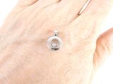 a hand that has a ring on it and a ring on it