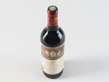 a bottle of wine that is sitting on a table