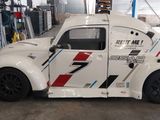 a white car that is parked in a garage