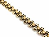 an image of a close up of a chain with holes on it