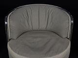an image of a chair with a round seat on a black background