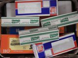 a box full of boxes of mail sitting on the floor