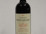 a bottle of wine that is sitting on a table