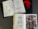 three pages of comics are spread out on a table