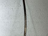 a knife that is hanging on the wall