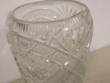 a glass vase that is sitting on a table