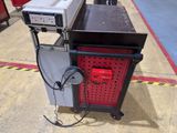 a machine that is sitting on a cart in a warehouse