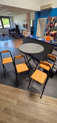 a room with a table and chairs in it