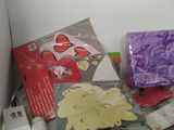 a pile of craft supplies sitting on a counter