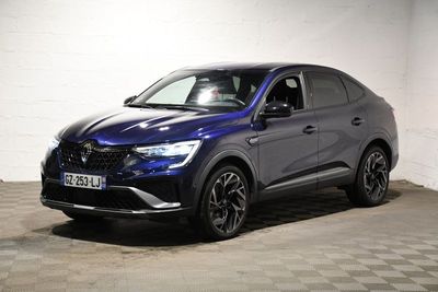 a blue suv parked in a garage with a checkered floor