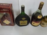 several bottles of liquor are lined up on a table