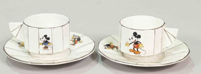 pair of mickey mouse coffee cups and saucers
