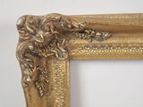 a picture of a gold frame with a lion on it