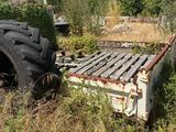 a truck bed that is sitting in the middle of a field