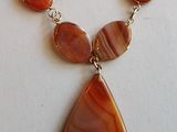 orange agate and silver necklace with a tear shaped pendant