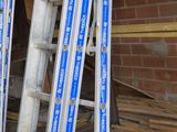 many ladders that are lined up against a wall