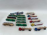 a lot of toy trains and trucks on a white surface