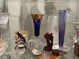 many vases on display in a glass case