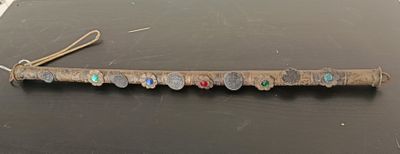 a piece of wood that has a bunch of coins on it