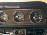 a dashboard of a car with three different gauges on it