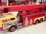 a toy fire truck and a toy firetruck on display