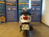 a scooter that is parked in a showroom
