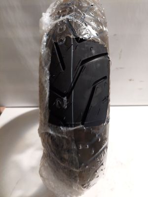 a pair of black shoes that are wrapped in plastic